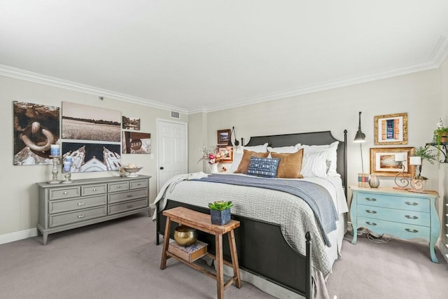 carpeted bedroom with visible vents, baseboards, and ornamental molding