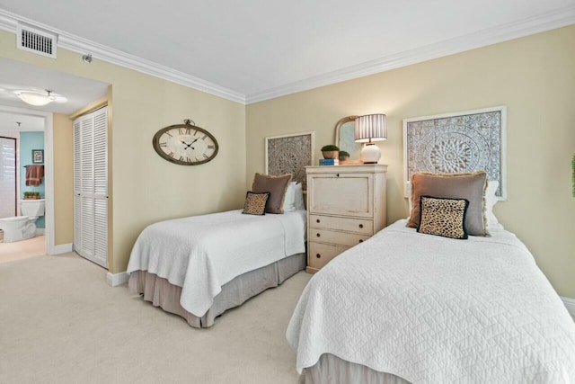 bedroom with crown molding, a closet, baseboards, carpet flooring, and visible vents