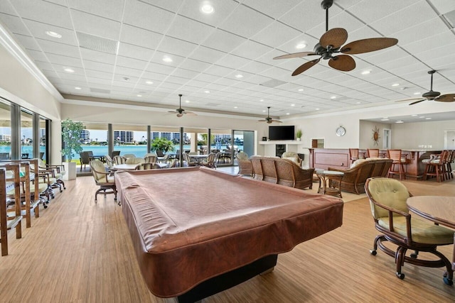 game room featuring a wealth of natural light, billiards, ornamental molding, and a ceiling fan