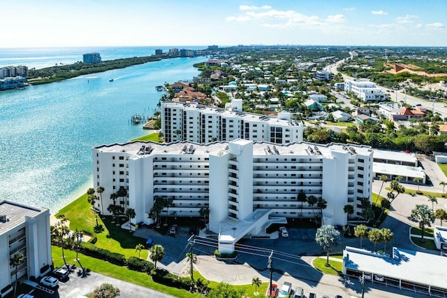 birds eye view of property with a city view and a water view