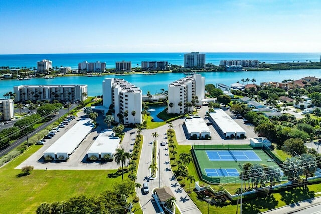 drone / aerial view featuring a water view and a view of city