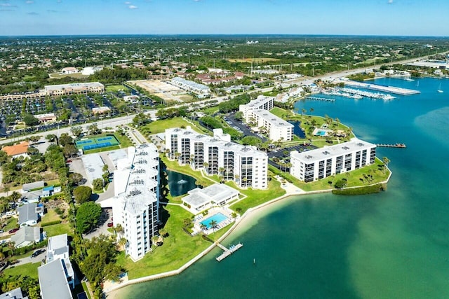 birds eye view of property with a view of city and a water view