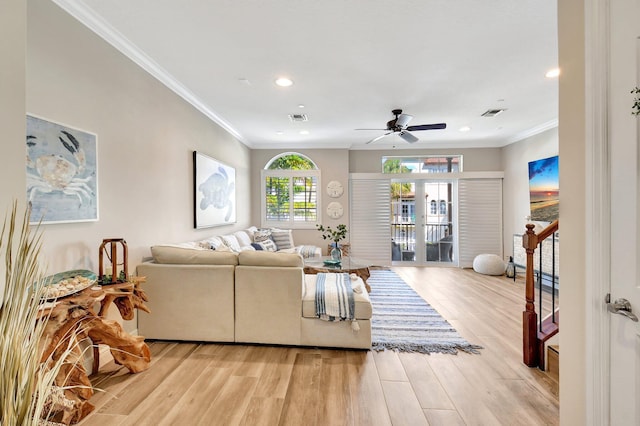 living room with light wood-type flooring, recessed lighting, visible vents, and ornamental molding