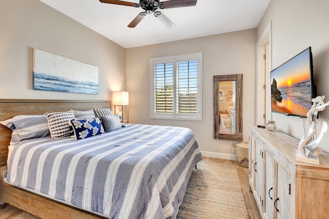 bedroom with baseboards and a ceiling fan