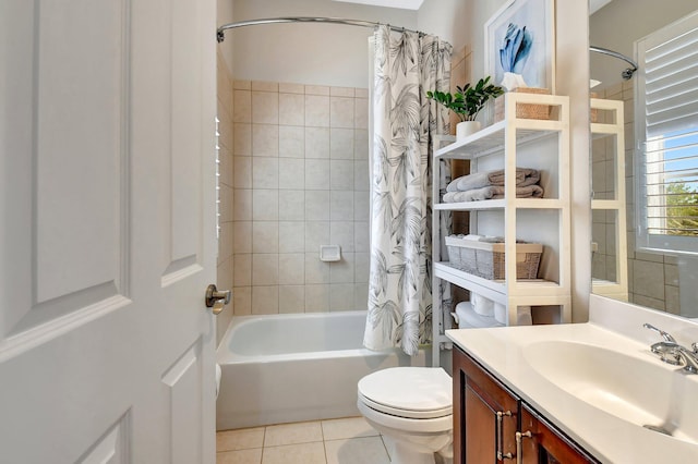 bathroom with toilet, tile patterned flooring, shower / bath combo with shower curtain, and vanity