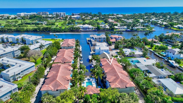 birds eye view of property with a residential view and a water view