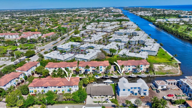 bird's eye view with a residential view and a water view