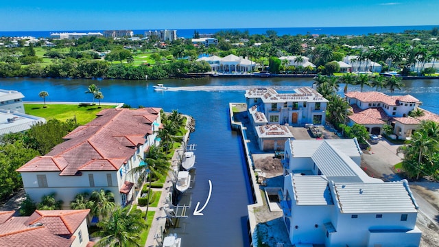 birds eye view of property featuring a water view