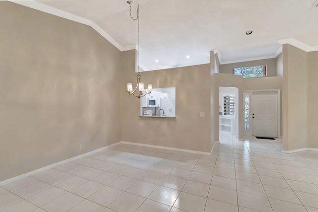 interior space featuring crown molding, baseboards, light tile patterned floors, a notable chandelier, and high vaulted ceiling