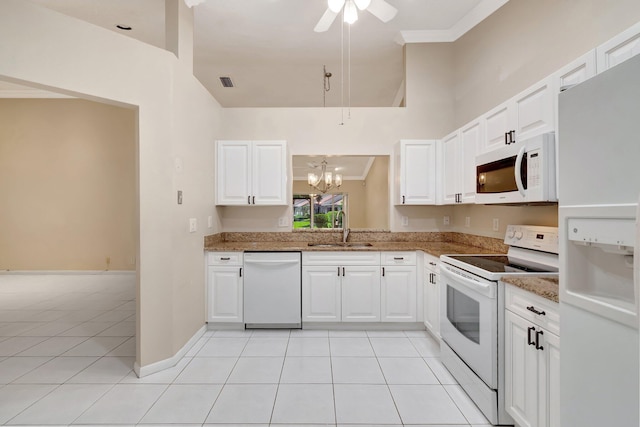 kitchen with a sink, visible vents, white appliances, and light tile patterned floors