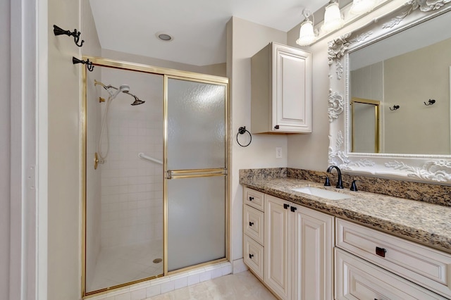 full bathroom featuring a stall shower and vanity