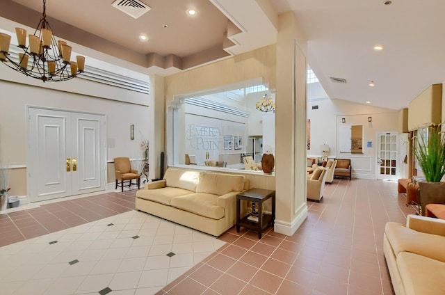 living room with visible vents, a notable chandelier, and tile patterned flooring