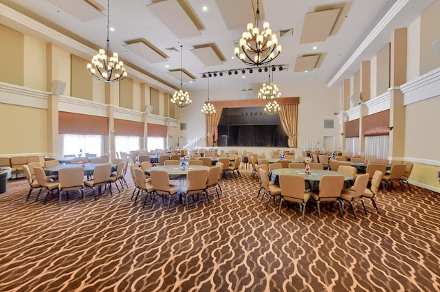 dining space featuring visible vents, a chandelier, carpet flooring, recessed lighting, and a high ceiling