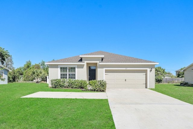 view of front facade featuring a front lawn, concrete driveway, a garage, and stucco siding