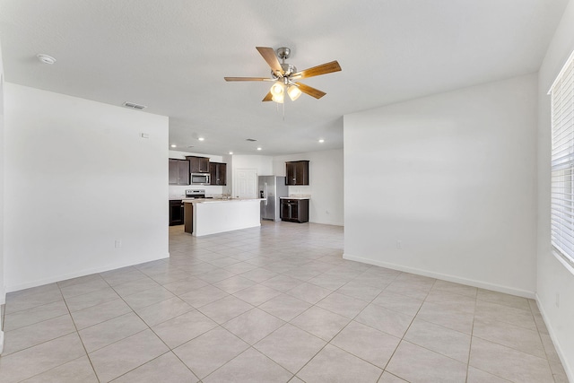 unfurnished living room featuring recessed lighting, a ceiling fan, visible vents, and baseboards