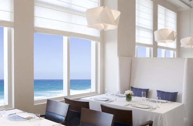 dining space with a water view