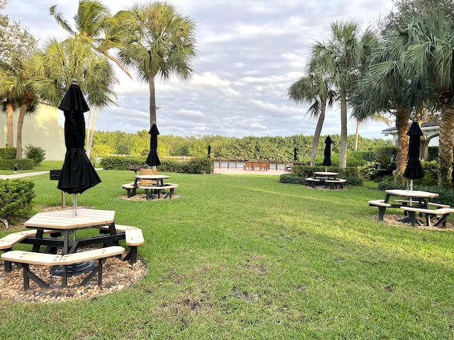 view of home's community with a lawn