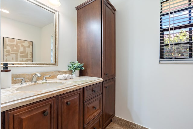 bathroom featuring tile patterned floors and vanity