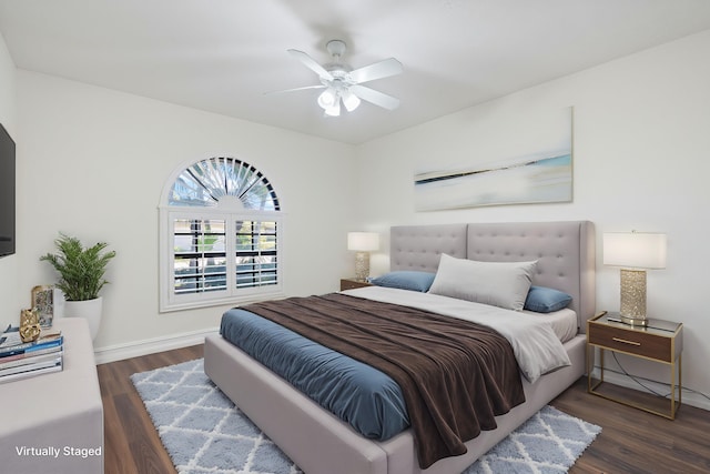 bedroom featuring baseboards, a ceiling fan, and wood finished floors