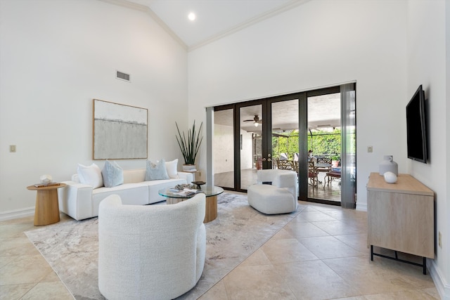 living area featuring visible vents, baseboards, high vaulted ceiling, and ornamental molding
