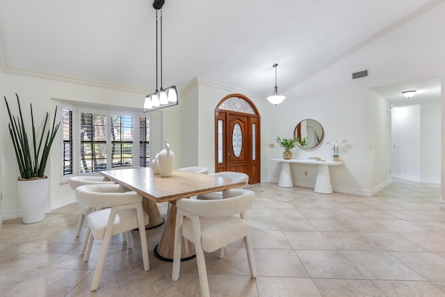 dining room with visible vents, crown molding, baseboards, light tile patterned floors, and high vaulted ceiling