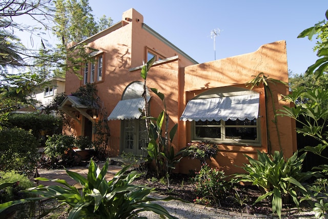 view of side of home with french doors