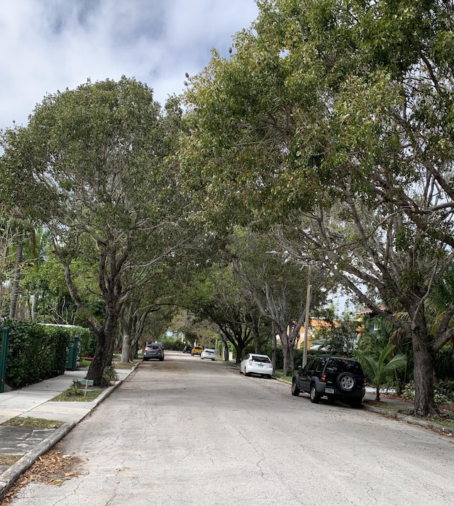 view of road with sidewalks and curbs