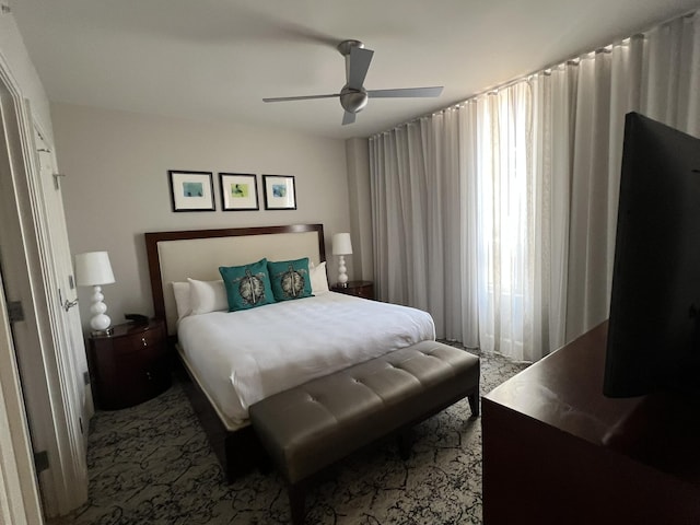 carpeted bedroom featuring a ceiling fan