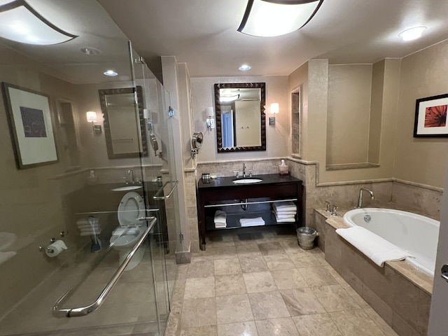 bathroom with vanity, a shower stall, and a bath