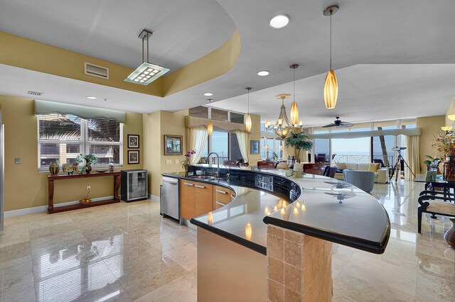 kitchen with beverage cooler, baseboards, dishwasher, dark countertops, and a sink