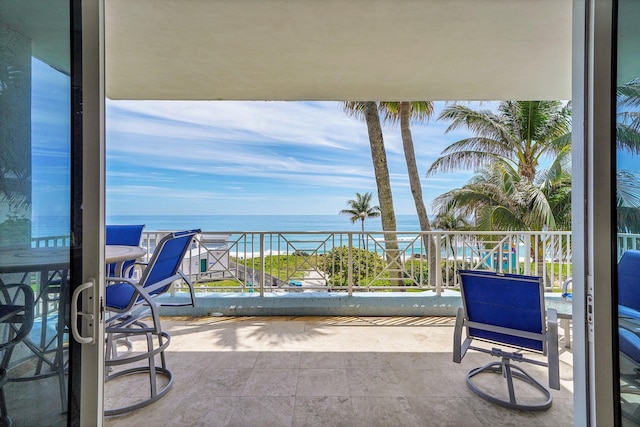 balcony featuring a water view