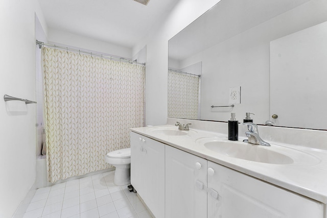 full bath featuring double vanity, tile patterned flooring, toilet, and a sink