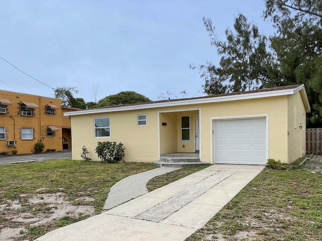 ranch-style house with stucco siding, concrete driveway, fence, a garage, and cooling unit