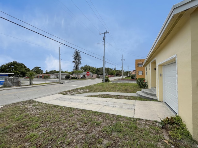 view of yard featuring a garage