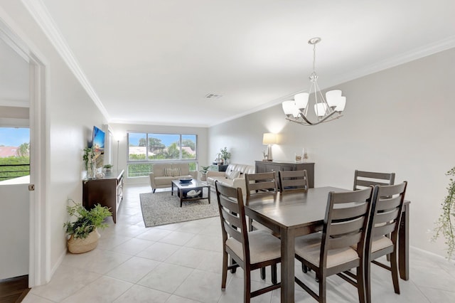 dining space featuring light tile patterned flooring, baseboards, crown molding, and an inviting chandelier