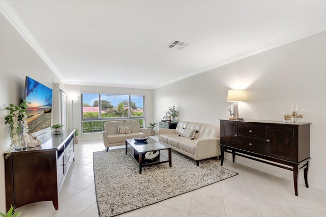 living room with light tile patterned flooring, visible vents, and ornamental molding