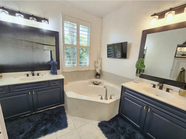123 E Prive Cir, Delray Beach, FL 33445 - bathroom with two vanities, a bath, and tile patterned floors