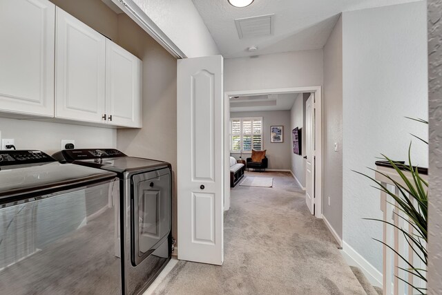123 E Prive Cir, Delray Beach, FL 33445 - washroom with cabinet space, washer and clothes dryer, light colored carpet, and baseboards