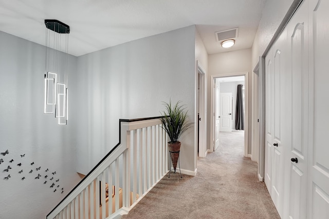 123 E Prive Cir, Delray Beach, FL 33445 - corridor with light colored carpet, an upstairs landing, and baseboards