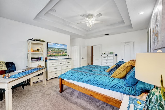123 E Prive Cir, Delray Beach, FL 33445 - bedroom featuring a raised ceiling, light carpet, and ceiling fan