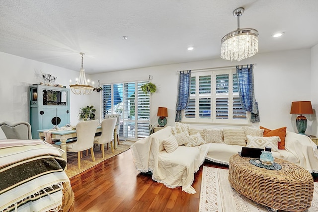123 E Prive Cir, Delray Beach, FL 33445 - living room featuring a chandelier, wood finished floors, and recessed lighting