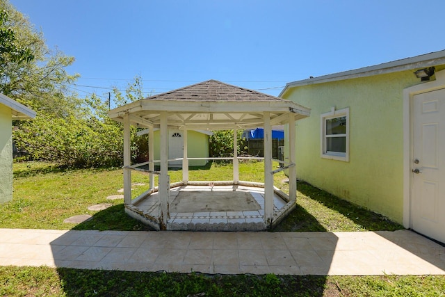 2624 S 27th St, Fort Pierce, FL 34981 - view of yard with a patio, fence, a gazebo, an outdoor structure, and a storage unit