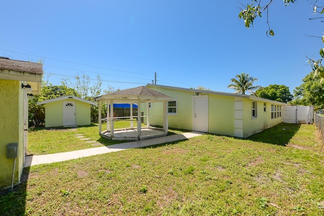 2624 S 27th St, Fort Pierce, FL 34981 - back of property with an outbuilding, a shed, fence private yard, and a yard