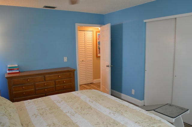 unfurnished bedroom with baseboards and visible vents