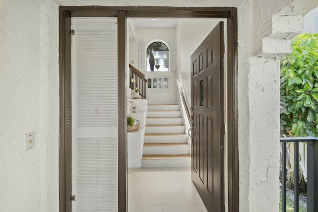 entrance to property with stucco siding