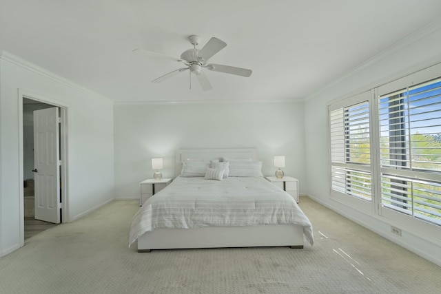 bedroom with light carpet, crown molding, baseboards, and ceiling fan