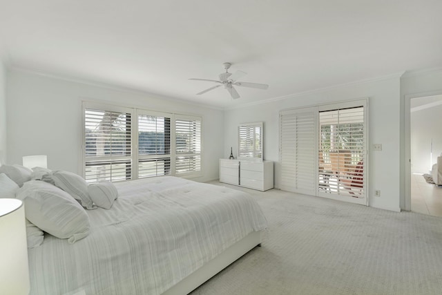 carpeted bedroom with ceiling fan, access to outside, and crown molding