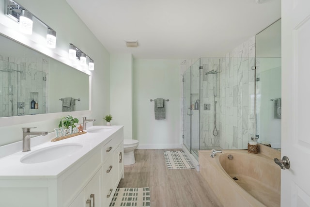 bathroom with a garden tub, a sink, and a shower stall