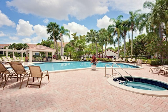 pool featuring a patio area and fence