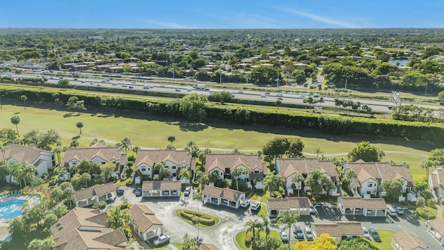 birds eye view of property featuring a residential view and view of golf course